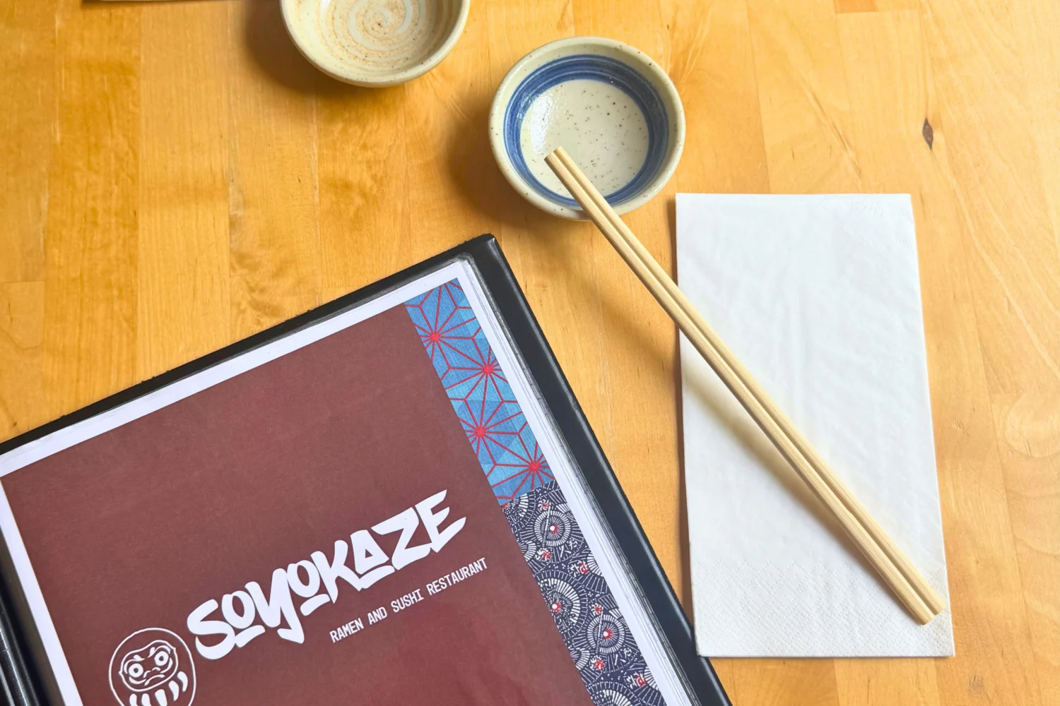 Soyokaze menu on a table with some chopsticks