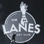 The Lanes Comedy Club Logo with microphone